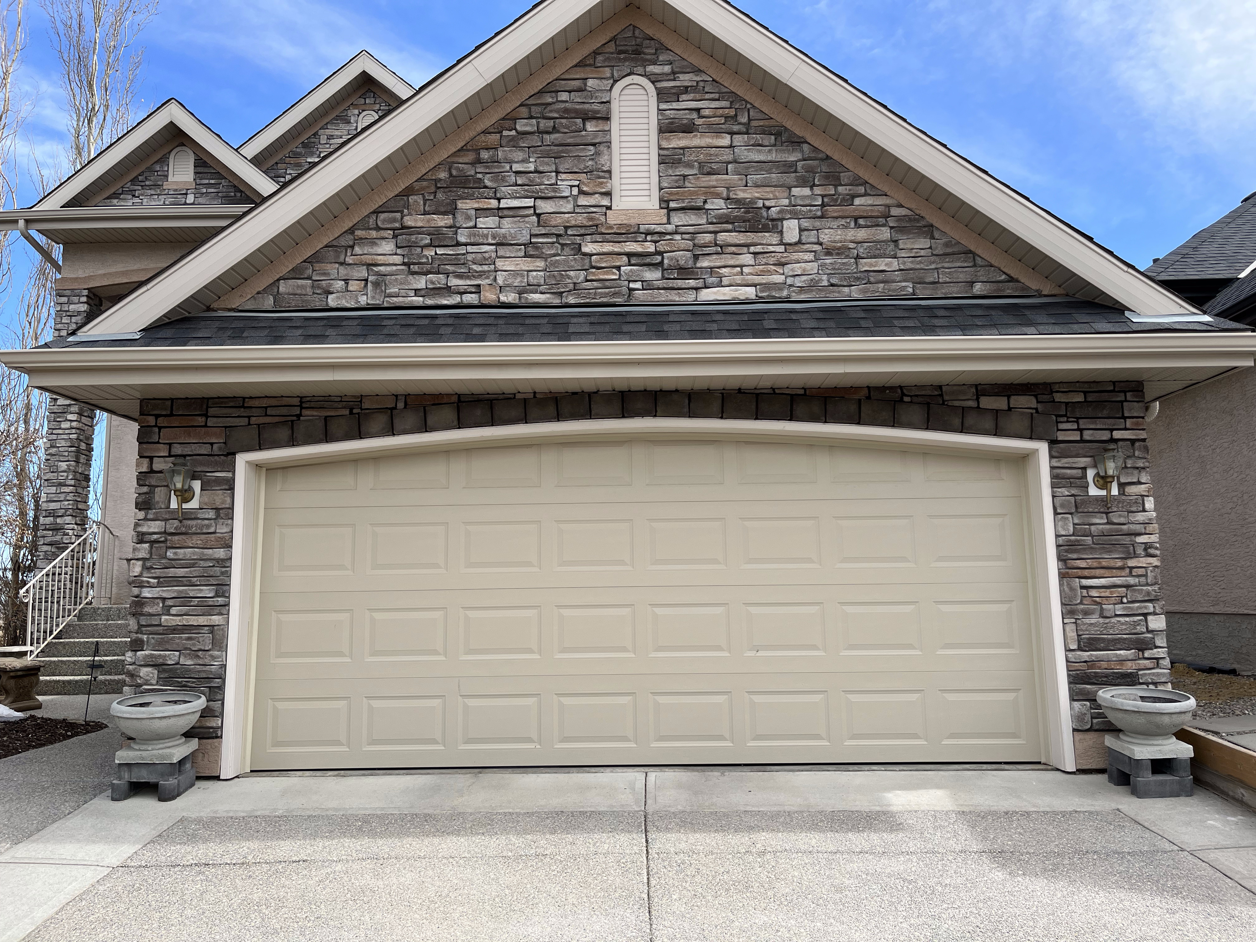 Stacked stone veneer on a Calgary home front elevation