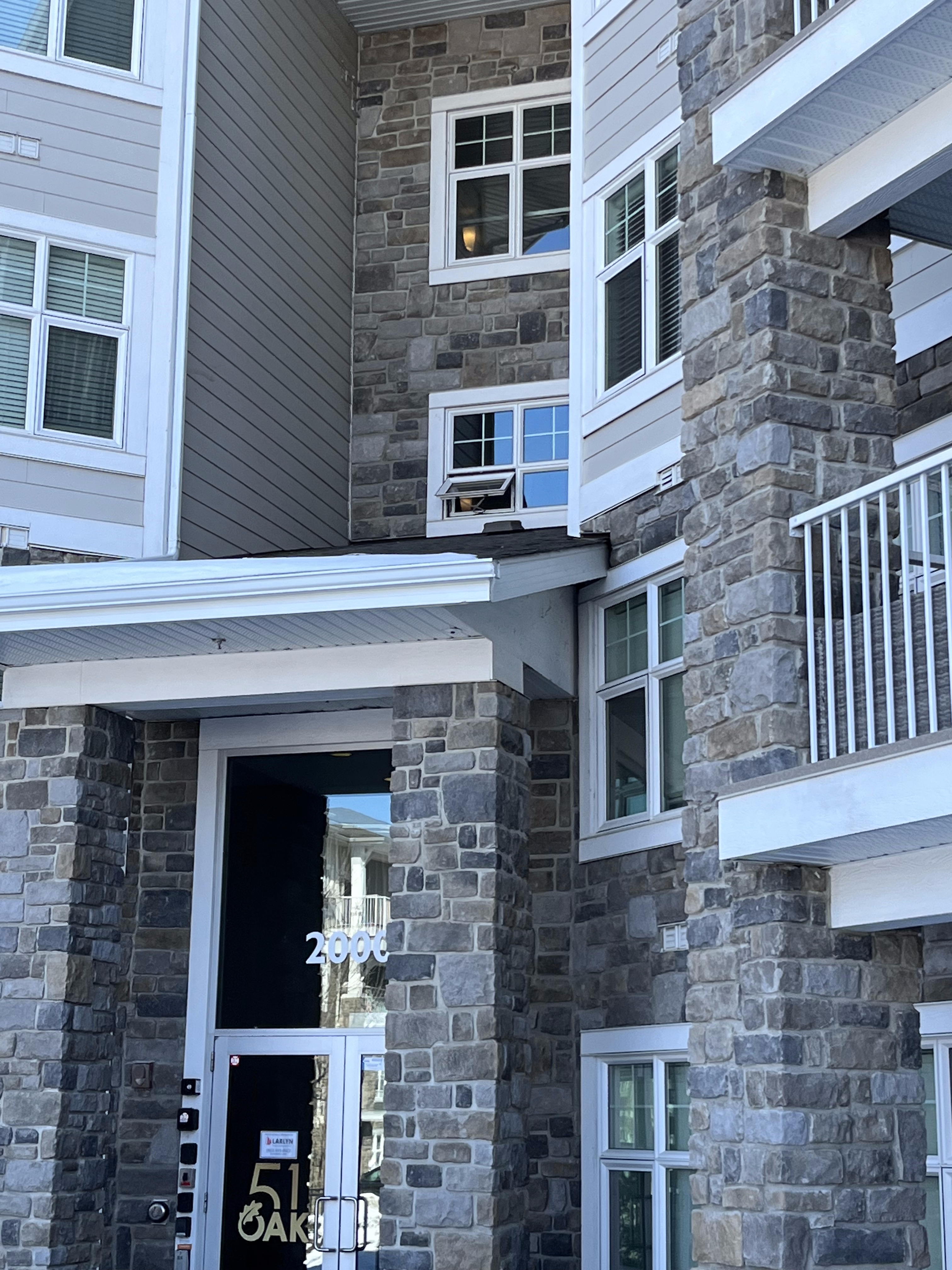 Stone veneer entrance at a Calgary apartment building