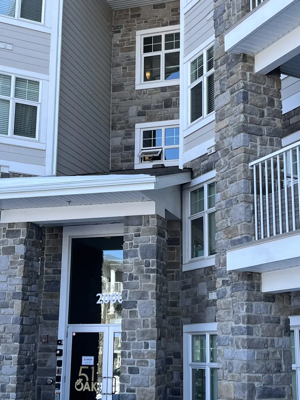 Stone veneer entrance at a Calgary apartment building